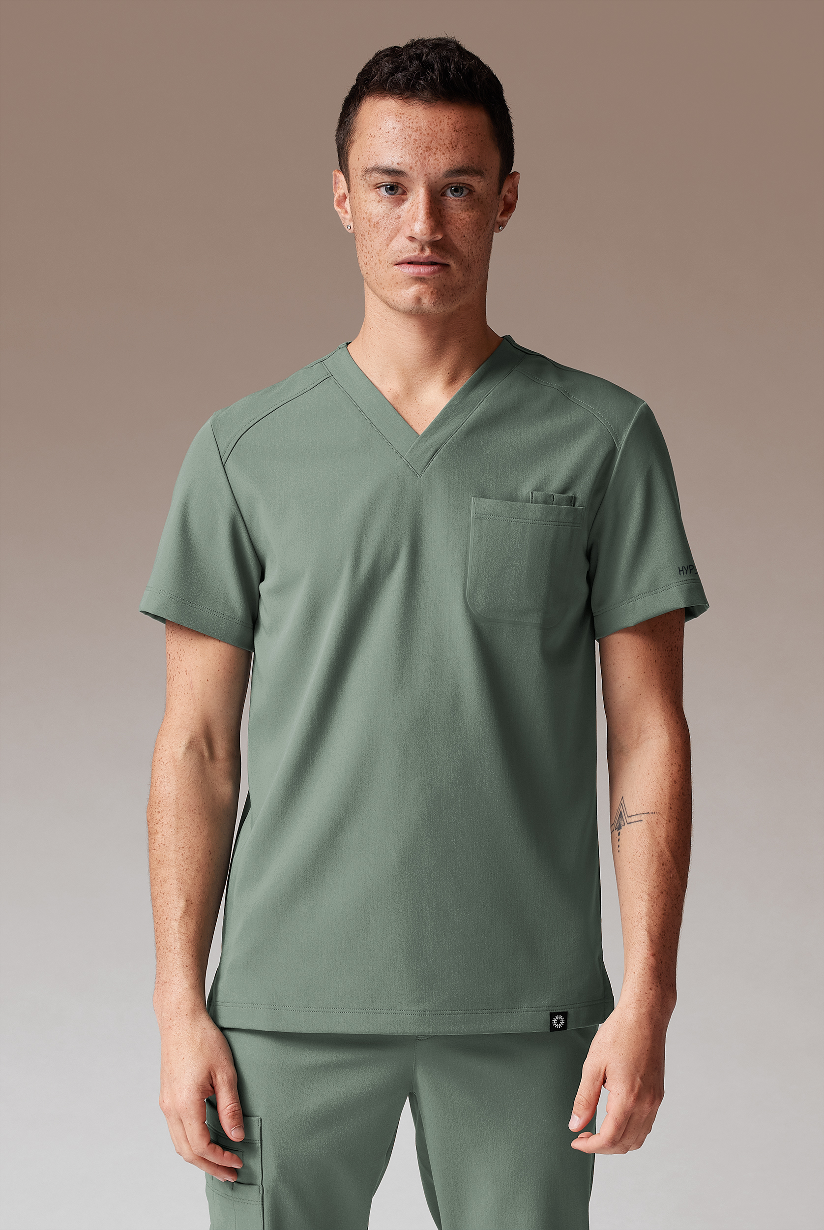 Hypothesis System Men’s 3-Pocket V-Neck Tuck In/Wear Out Scrub Top